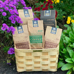 Vermont Coffee Company: A Friend to the Planet | Vermont Coffee Company bags of coffee in a basket surrounded by flowers